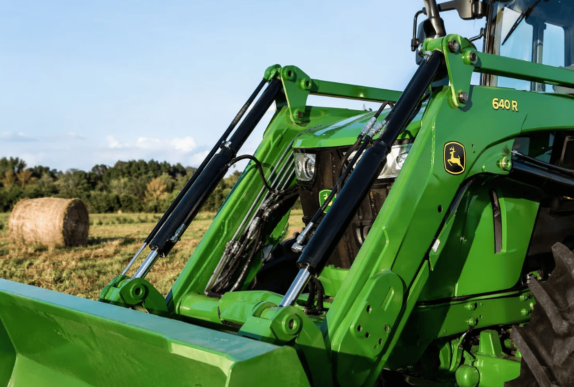 Welded hydraulic cylinders installed on agricultural tractor loader